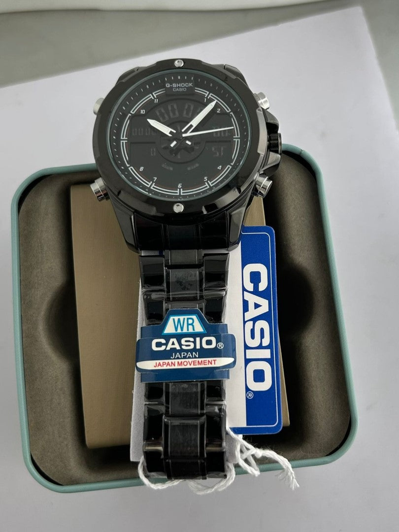 Black Casio watch in packaging on a gray surface