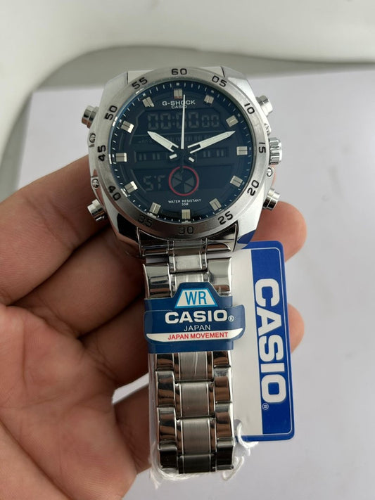 Casio watch held in a hand with a visible Casio tag on a light background