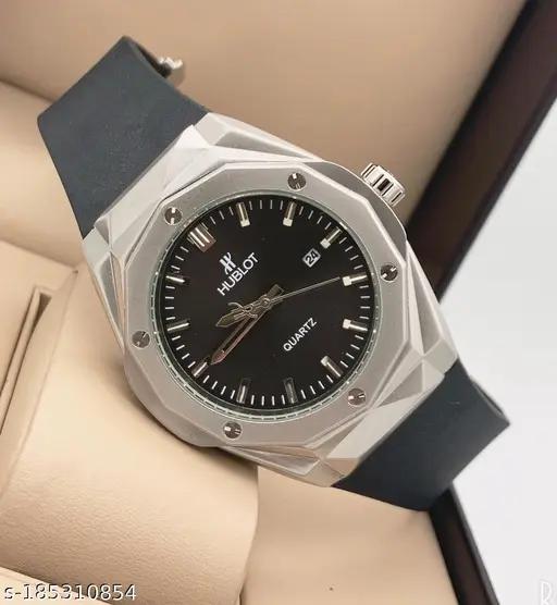 Hublot watch with black face and silver case on a person's wrist
